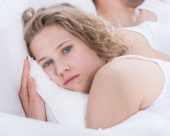 Worried woman in bed
