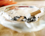 An ash tray with cigarettes in